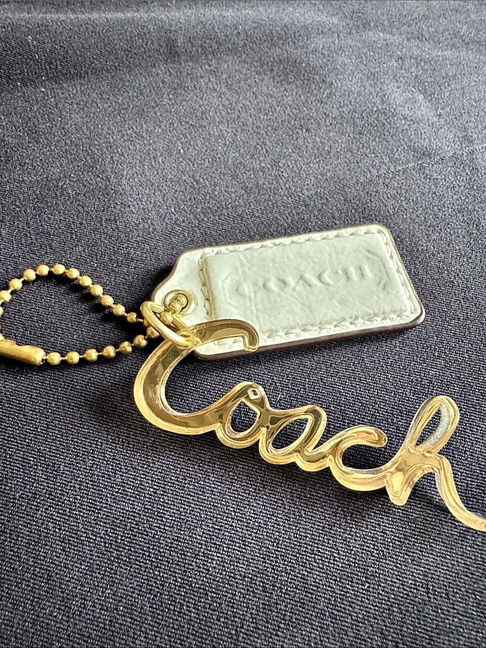 Coach Poppy Acrylic Script Logo Hangtag Bag Charm Gold & Cream